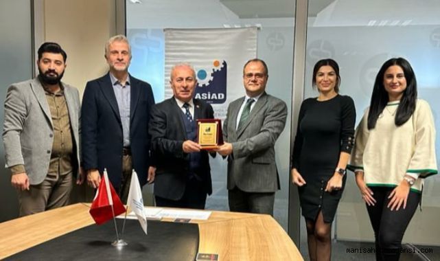 HAKAN BERKTAŞ'A ANLAMLI PLAKET